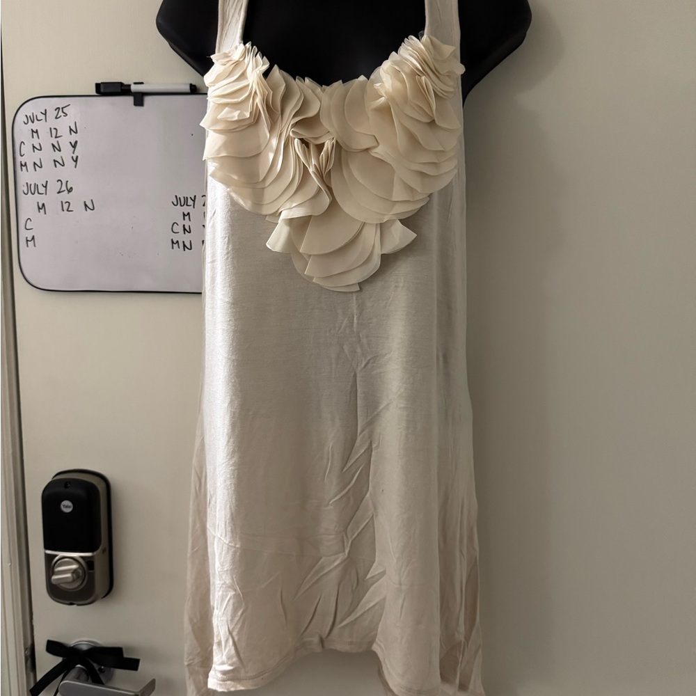 Elegant Cream Sleeveless Dress with Ruffle Detail